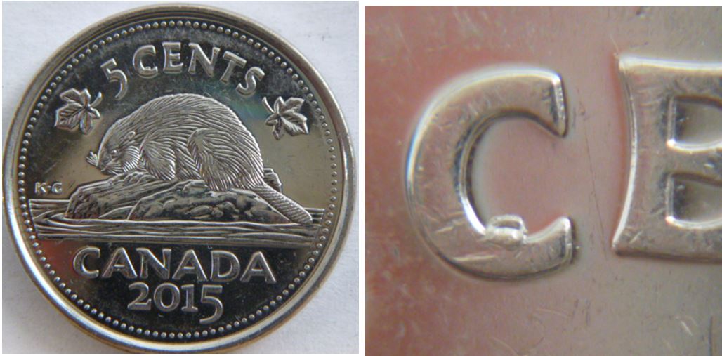 5 Cents 2015-Éclat de coin dans le C de Cents.JPG