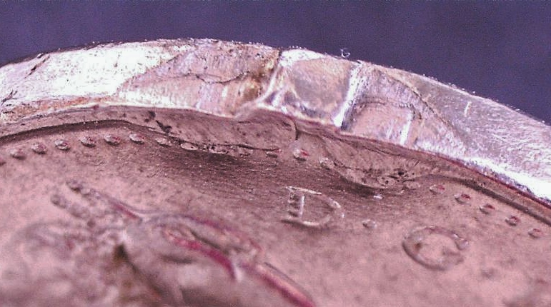 0.05-1979 -Coin brisé -cc.jpg