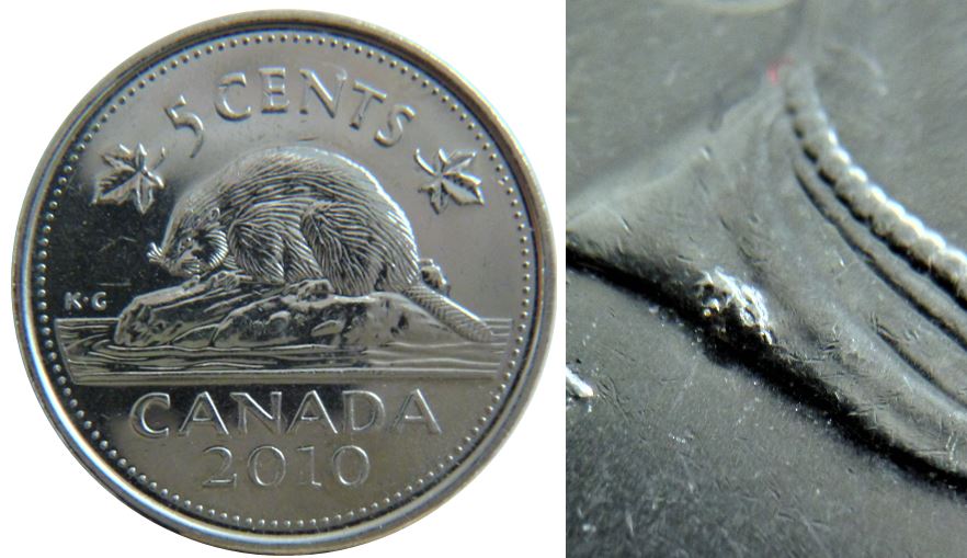 5 Cents 2010-Éclat coin sur la signature coté avers-1.JPG