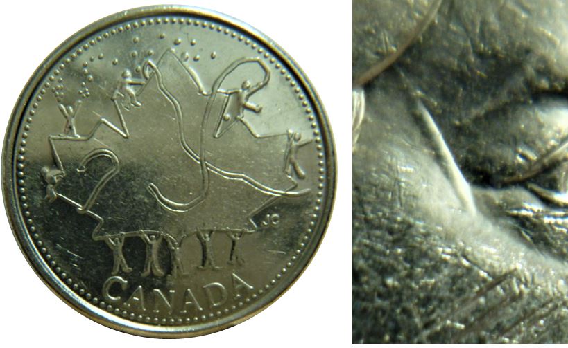 25 Cents 2002p Canada Day -Dommage du coin sur la temple de effigie-3.JPG
