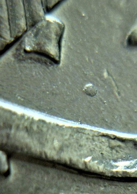 25 Cents 2000 Fièrté-Point près de la patte du 2 en ruben-2.JPG
