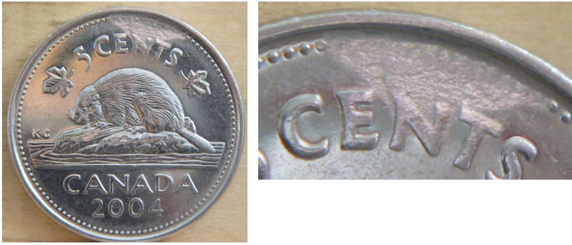 5 Cents 2004-Frappe a travers graise au revers.JPG