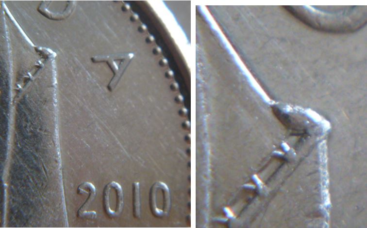 10 Cents 2010- Éclat de coin sur la voile.JPG