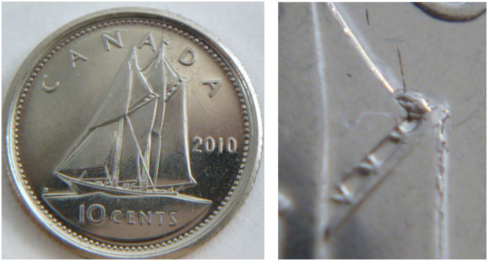 10 Cents 2010-Dommage de coin devant le bateau-1.JPG