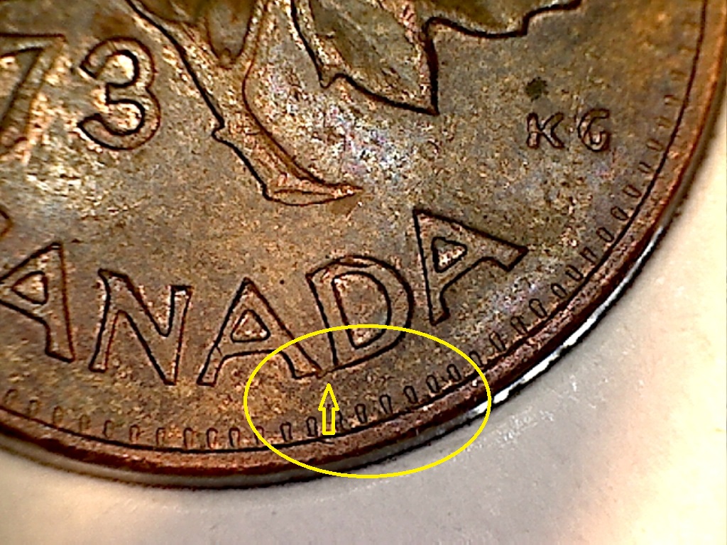 1973  Coin fendillé entre le 2e A et le D de CANADA.jpg