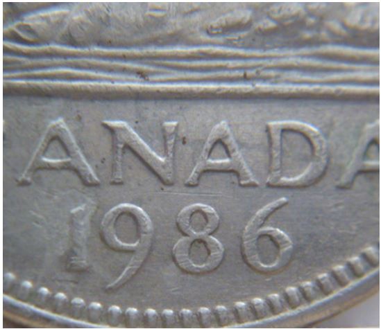 5 Cents 1986-Accumulation sur la date-1.JPG