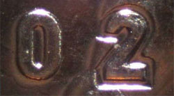 25 cents 2009 - Men's Hockey Colour Incuse 2