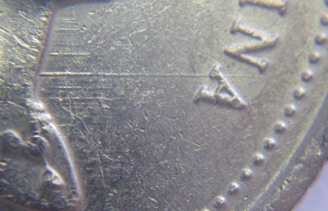 10 Cents 1996-Dommage du coin devant effigie-2.JPG