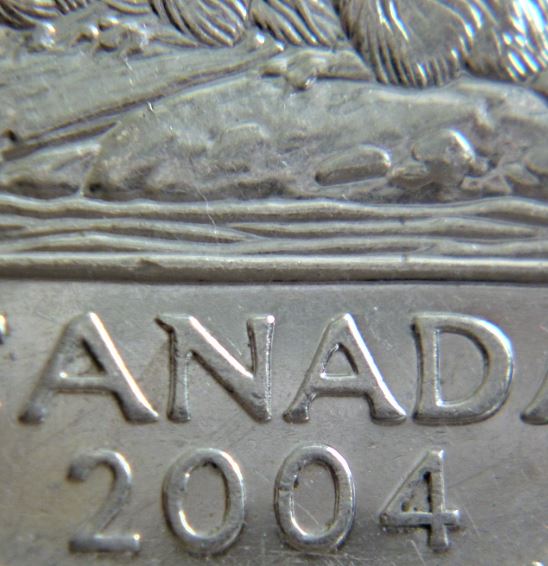 5 Cents 2004-2 Éclats du coin patte arrière-Un fil a la patte avent-1.JPG