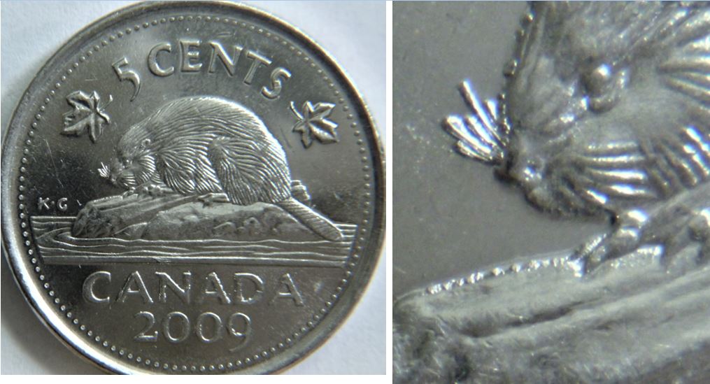 5 Cents 2009-Coin entrechoqué bouche du castor+accumulation au revers-1.JPG