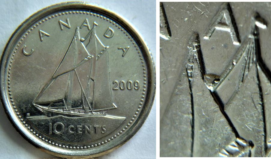 10 Cents 2009-Éclat coin entre les voiles sous le A de canAda-.JPG