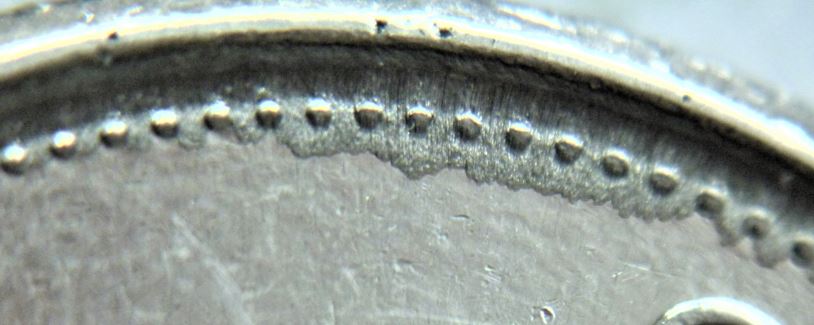 10 Cents 2007-Dépôt de métal sur les perles au coté revers de 8H à 10H-3.JPG