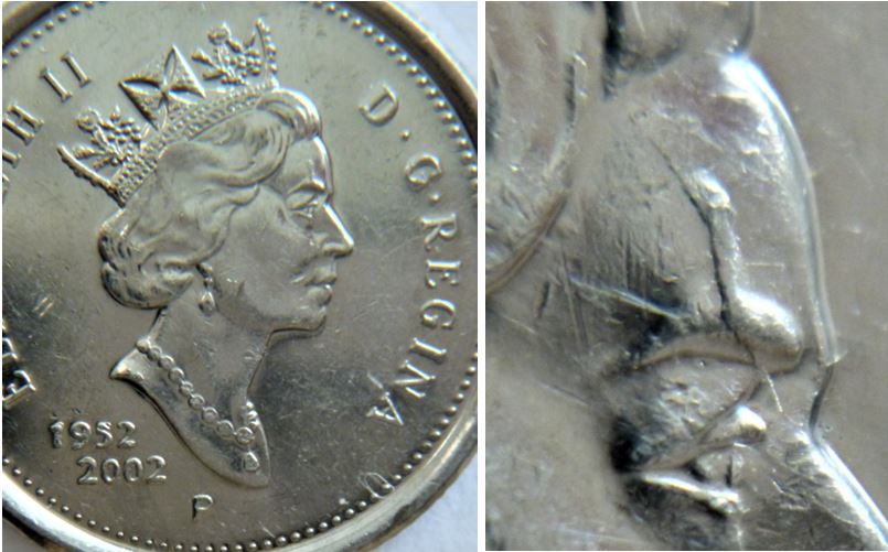 10 Cents 2002p- Éclat du coin sur la sourcil-2.JPG