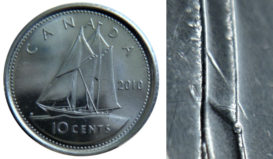 10 Cents 2010-Dommage du coin a travers la voile-1.JPG