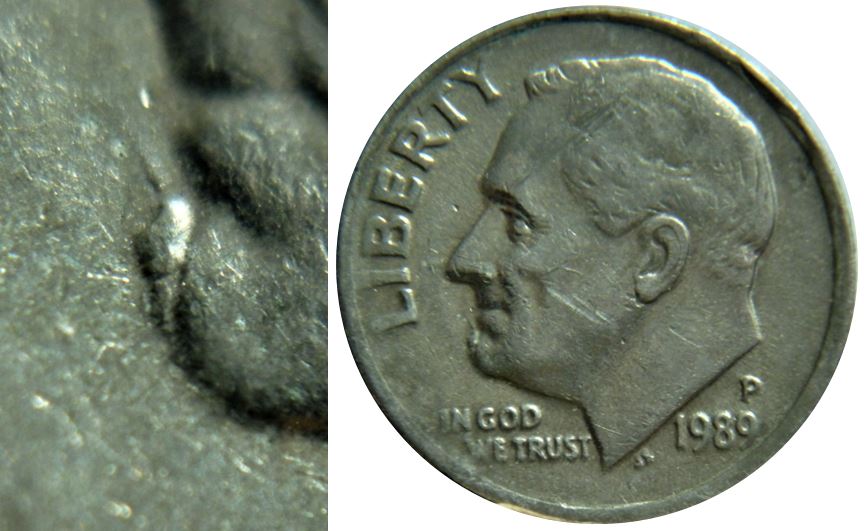 10 Cents 1989p USA-Escargot sur le menton de effigie-Éclat du coin-,1.JPG