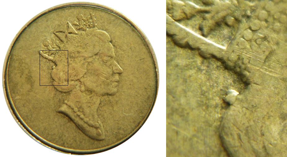 2 Dollars 1999 N-Éclat coin derrière la courronne-2.JPG