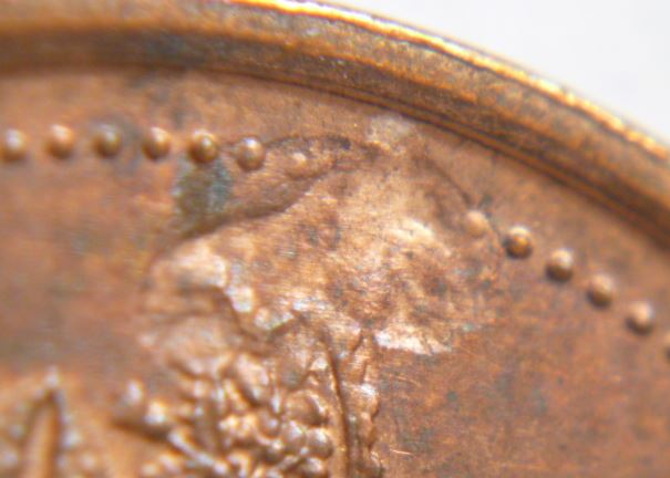 1 Cent 1997-Frappe a traver graisse coté avers -2.JPG