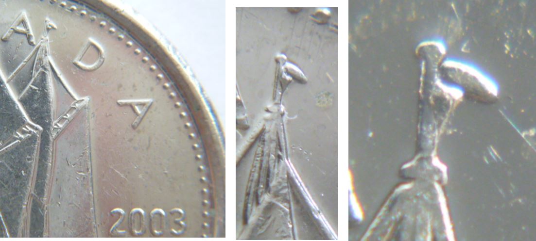 10 Cents 2003- Éclat de coin sous le trapeau.JPG