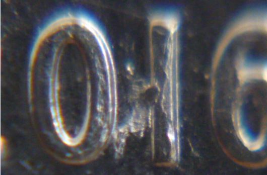 10 Cents 2016-Défaut de laminage entre le 0 et 1-2.JPG