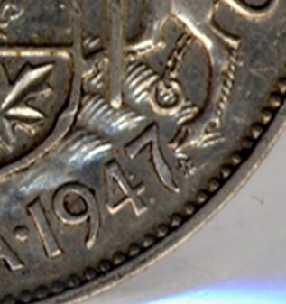 50 cents 1947 - Curved 7 - Maple leaf